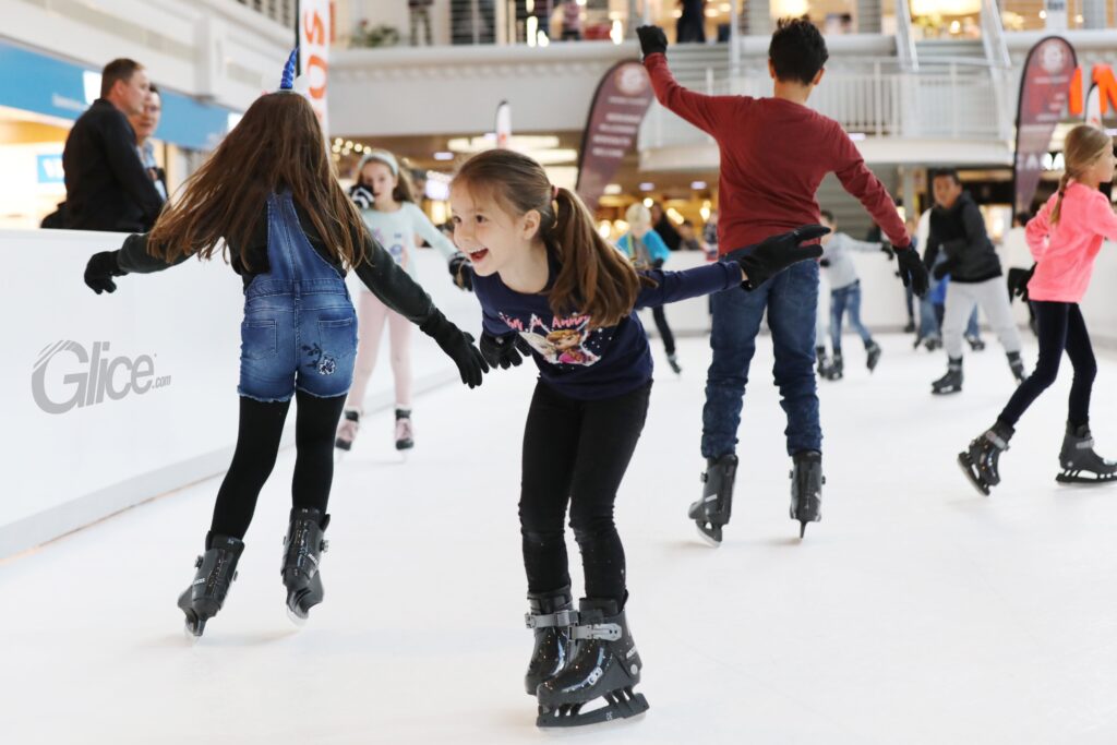 Children Enjoying Sustainable Skating Fun on Glice Eco Rink supplied in the UK by FX Live