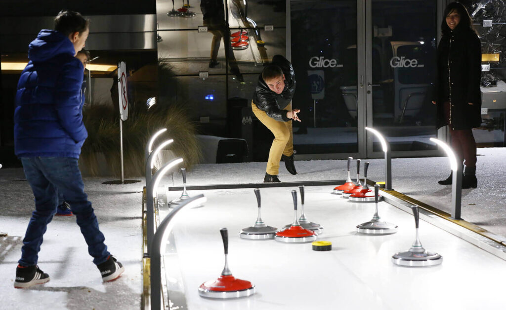 Eisstock Game on Glice Eisstock Track at Hotel Kempinski in Geneva. Demonstrating uses for Glice Eco Ice Rink panels. FX Live is the only UK supplier.